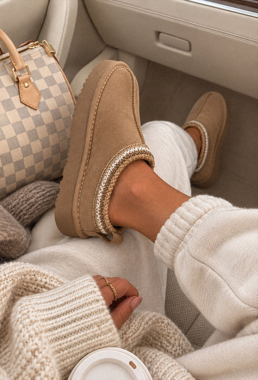 Sand faux fur lined boot with green Aztec trim, round toe and chunky sole in a cosy slip-on style.