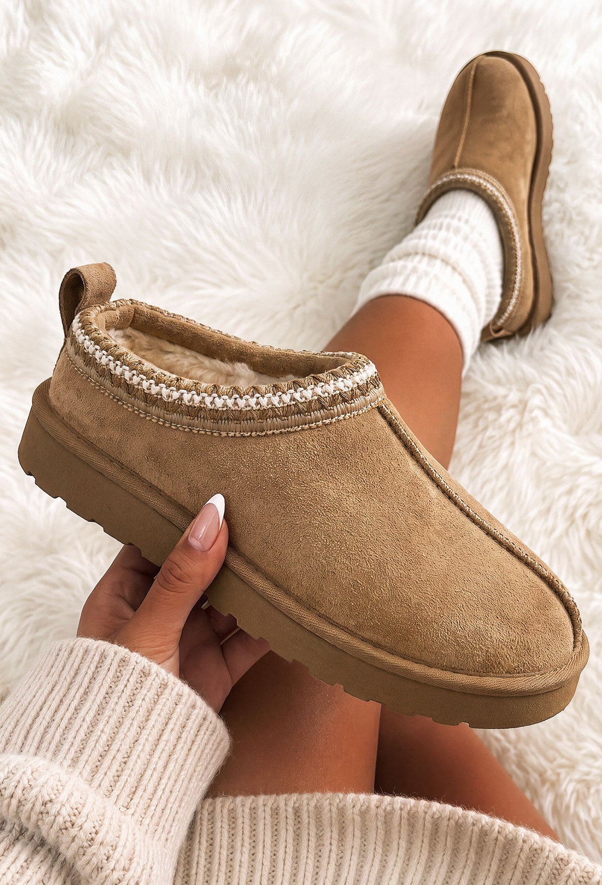Sand faux fur lined boot with green Aztec trim, round toe and chunky sole in a cosy slip-on style.